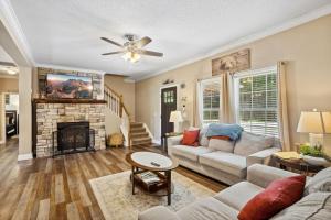 a living room with a couch and a fireplace at Red Bear Run in Beech Mountain