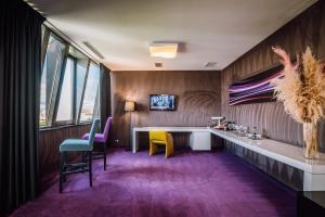 TV a/nebo společenská místnost v ubytování Plaza V Executive Hotel