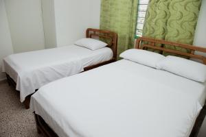 Letto o letti in una camera di Hotel Casa Verde Guatapé