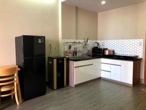 Kuchyň nebo kuchyňský kout v ubytování Windy homestayPR