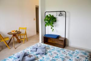 a living room with a bed and a table at Villa del Lupo in Santa Maria la Palma