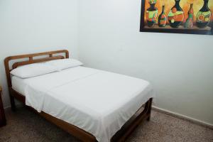 Letto o letti in una camera di Hotel Casa Verde Guatapé