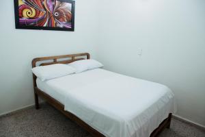 Letto o letti in una camera di Hotel Casa Verde Guatapé