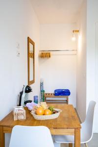 a dining room table with a bowl of fruit on it at Villa del Lupo in Santa Maria la Palma