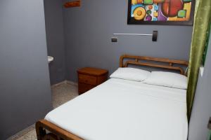 Letto o letti in una camera di Hotel Casa Verde Guatapé