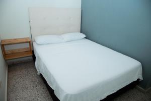 Letto o letti in una camera di Hotel Casa Verde Guatapé