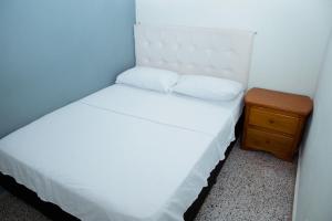 Letto o letti in una camera di Hotel Casa Verde Guatapé