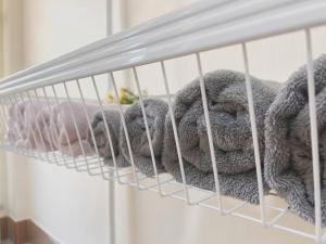 a bunch of stuffed rabbits in a cage at The Betong Life Guesthouse in Betong +25 photos