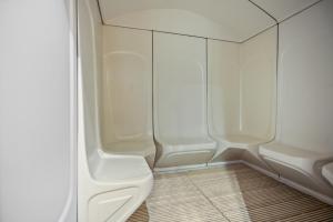 a small bathroom with white walls and a toilet at Luxury studio at JLT near metro in Dubai