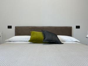 Postel nebo postele na pokoji v ubytování Appartamento Lotus 85