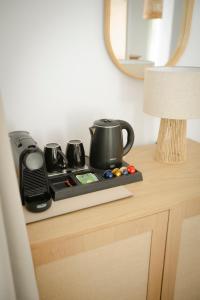 a tray with pots and pans on top of a table at Villa Vivari Suites in Vivari