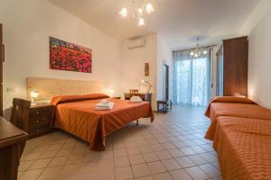 Katil atau katil-katil dalam bilik di IL VIVAIO Bed and Breakfast