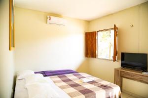 TV a/nebo společenská místnost v ubytování Camping e Pousada Três Lagoas