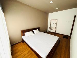 Uma cama ou camas num quarto em Havelock City Hostel, Colombo