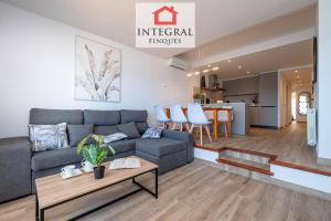 a living room with a couch and a table at Apartament Made in Costa Brava in Sant Antoni de Calonge