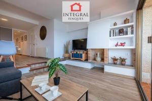 a living room with a couch and a table at Apartament Made in Costa Brava in Sant Antoni de Calonge