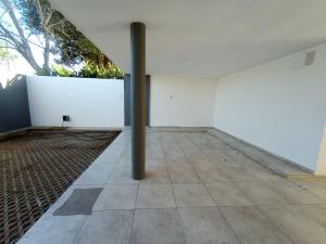 an empty room with a pole in the middle of a building at Monoambientes MOKA in Concepción del Uruguay