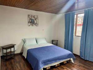 Ένα ή περισσότερα κρεβάτια σε δωμάτιο στο Carolina Hostel