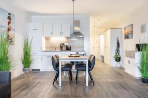 Kuchyň nebo kuchyňský kout v ubytování Meerblickvilla Großenbrode Wohnung 21
