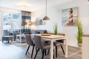 Posezení v ubytování Meerblickvilla Großenbrode Wohnung 21