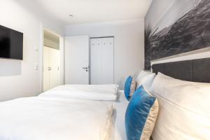Postel nebo postele na pokoji v ubytování Meerblickvilla Großenbrode Wohnung 21