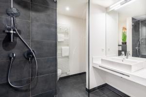 Koupelna v ubytování Meerblickvilla Großenbrode Wohnung 21