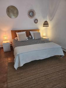 Postel nebo postele na pokoji v ubytování Siempre Feliz La Casita Los Molinos