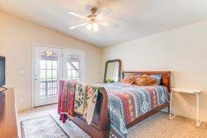 a bedroom with a bed and a ceiling fan at Remote Kingston Cabin with Mtn Views Fish and ATV! in Antimony