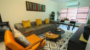 a living room with a couch and a table at Earthy and Organic in Johannesburg