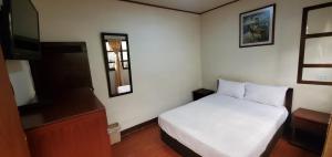Postel nebo postele na pokoji v ubytování Hotel Alcayata Popayan
