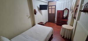 Postel nebo postele na pokoji v ubytování Hotel Alcayata Popayan