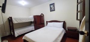 Postel nebo postele na pokoji v ubytování Hotel Alcayata Popayan