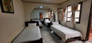 Postel nebo postele na pokoji v ubytování Hotel Alcayata Popayan