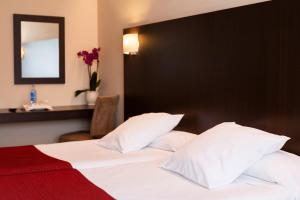 Cama o camas de una habitación en Hotel Santiago Apóstol