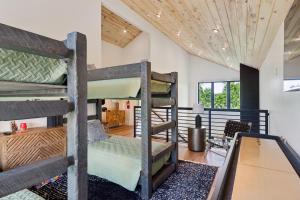 a room with three bunk beds in a house at Private Pool, Dog Friendly, Theater, Game Room! in Sevierville +58 photos