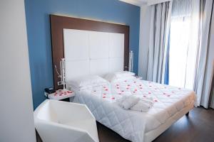 Postel nebo postele na pokoji v ubytování Hotel Napoleon