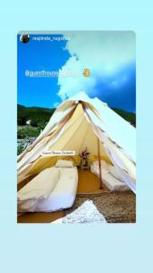a bell tent with two beds in it at Dedushi Guesthouse &Wood cabins-Camping place in Gusinje