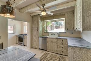 a kitchen with a sink and a window at Mid-Century Modern Taos Home with Hot Tub and Fire Pit in Taos