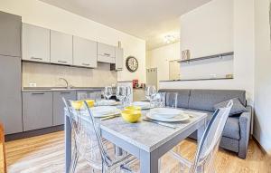 a kitchen and a dining room with a table and chairs at 1 Bedroom Lovely Apartment In Recco in Recco