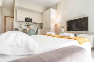 Posteľ alebo postele v izbe v ubytovaní Adorable flat with private parking in the center by REMS