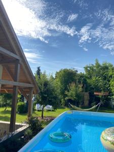 a swimming pool in the backyard of a house at B&B by Mo in Etyek