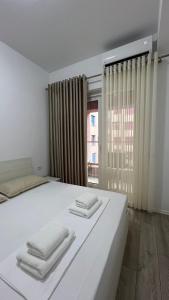 Ένα ή περισσότερα κρεβάτια σε δωμάτιο στο AK apartments