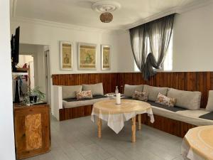 a living room with a couch and a table at Casa Tanger in Tangier