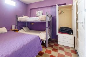 Postel nebo postele na pokoji v ubytování Puerta Azul Hostel
