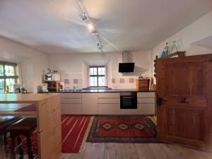 A kitchen or kitchenette at Piburg Seebichlhof