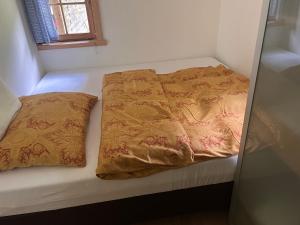 A bed or beds in a room at Piburg Seebichlhof
