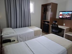 Postel nebo postele na pokoji v ubytování Hotel Gamboa Premium Macau