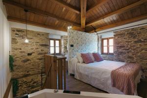 Кровать или кровати в номере casa Robaleira