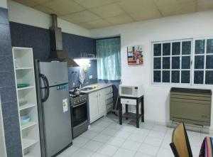 a kitchen with a refrigerator and a stove at Laprida 135 in Viedma