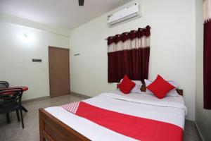 Postel nebo postele na pokoji v ubytování Super Hotel O Nandi Inn